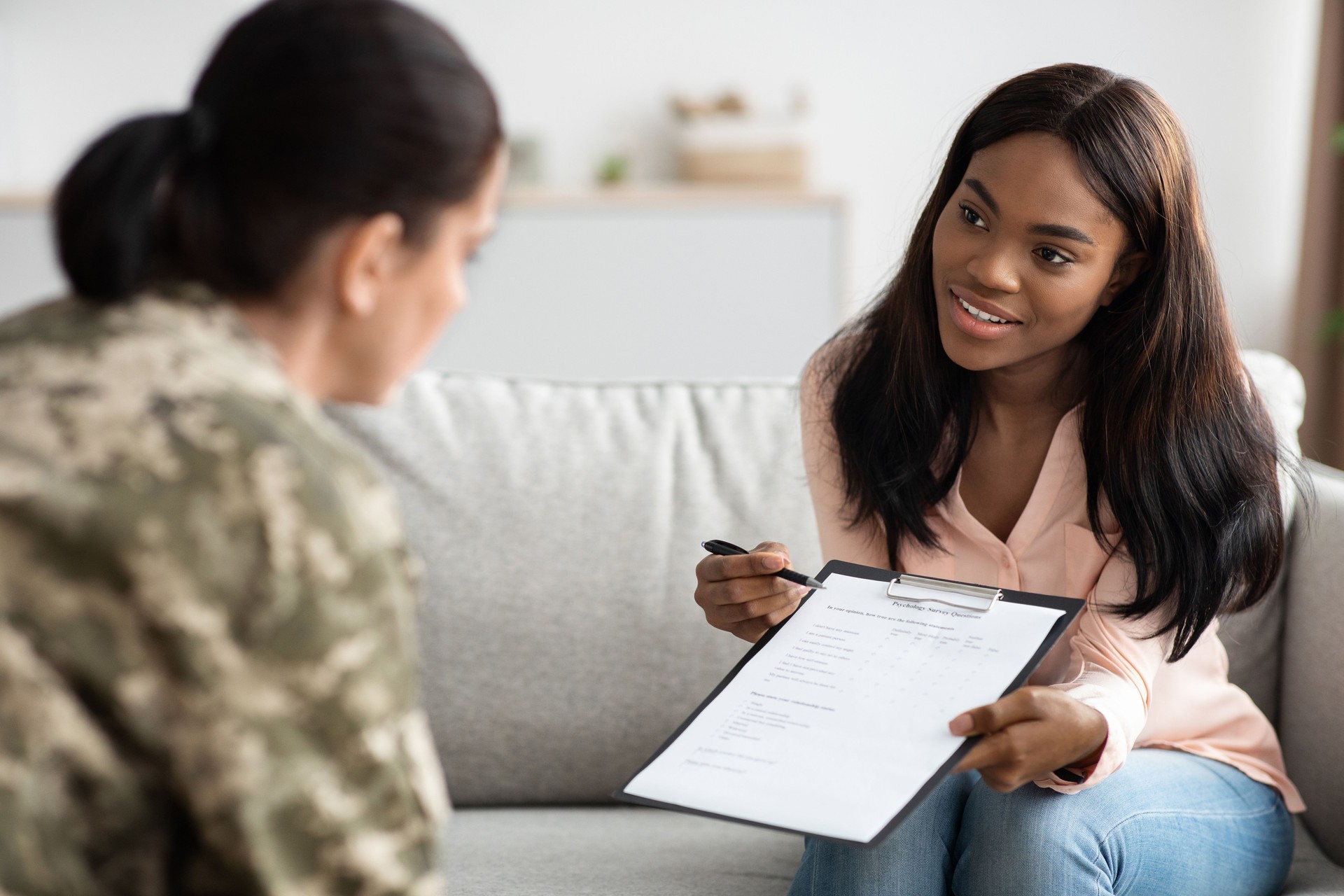 Psychology Survey. Black Psychiatrist Lady Holding Clipboard With Questionnaire, Testing Military Woman