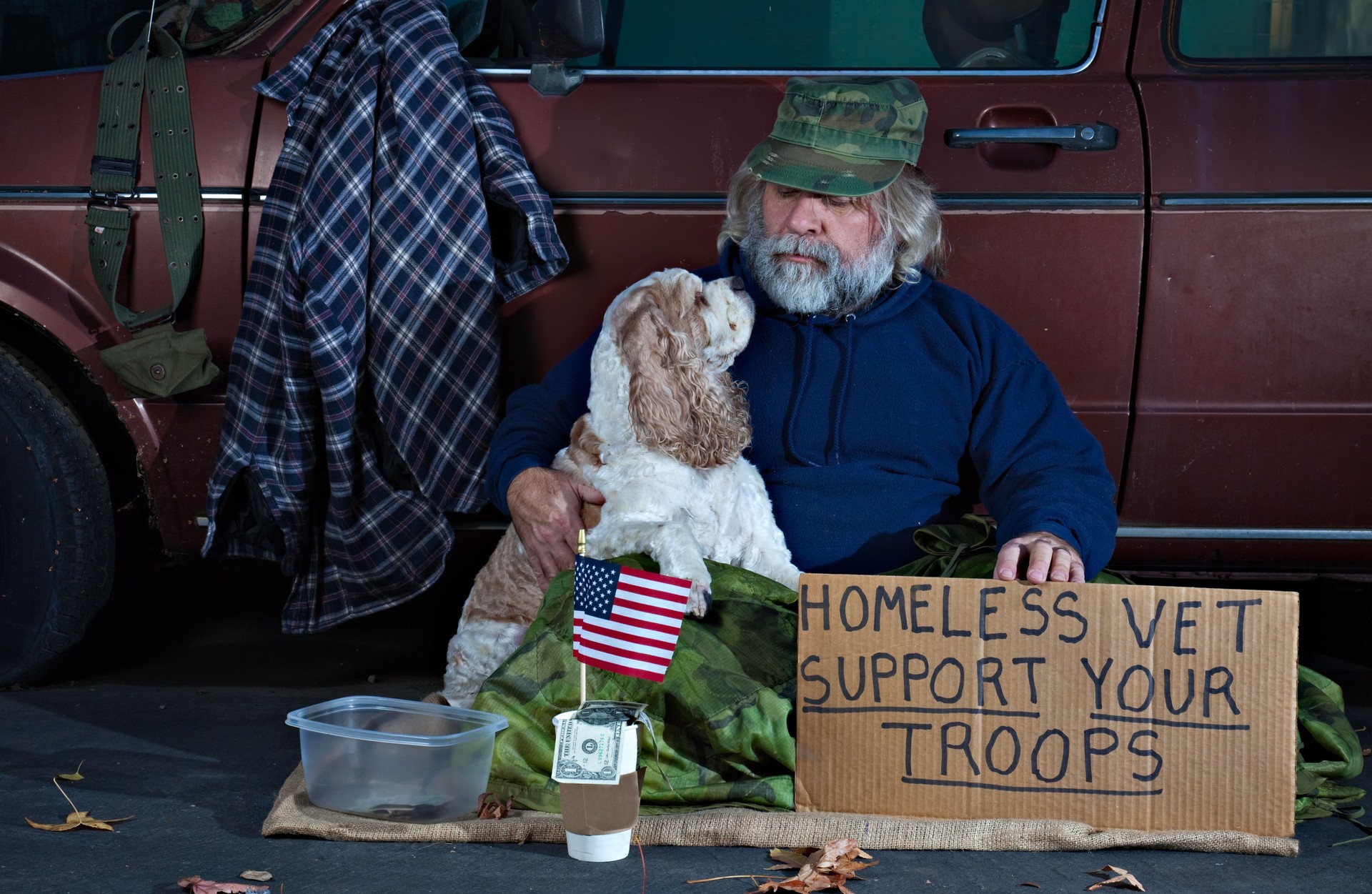 Veteran  Looking at His Dog